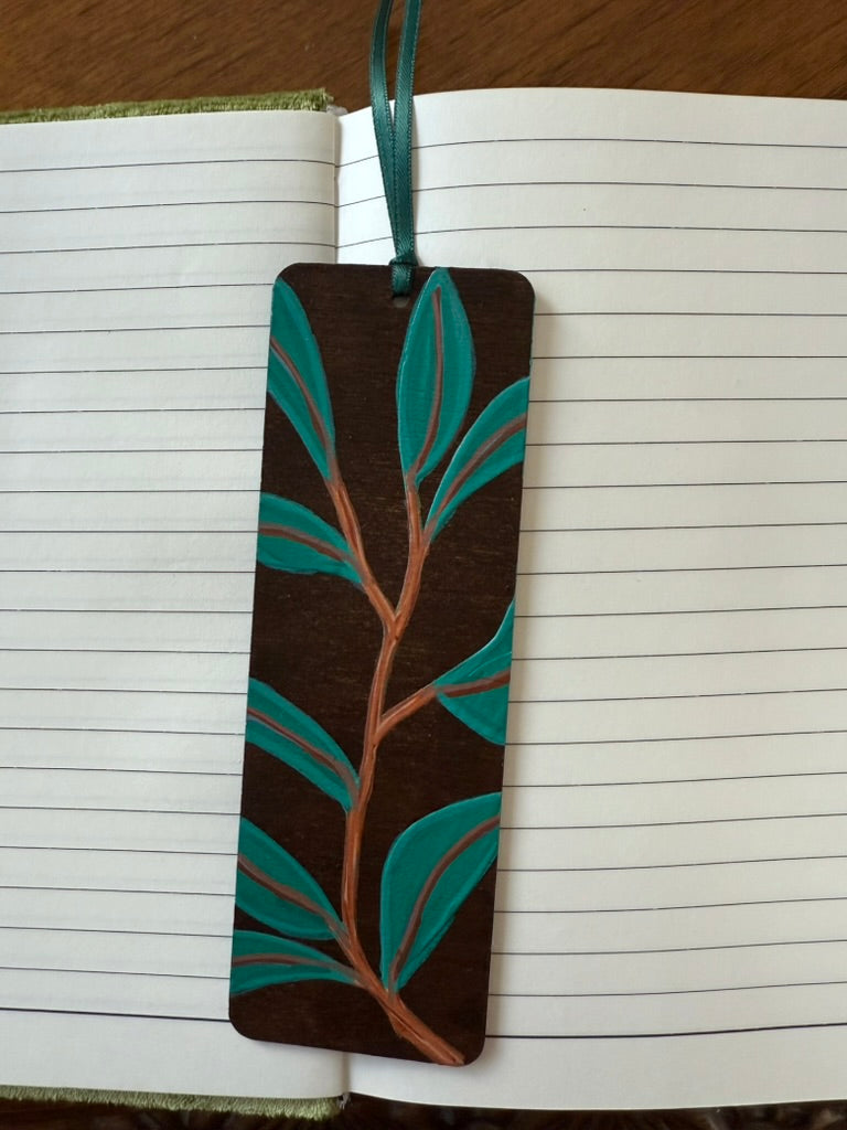 Bookmark with leaf design on a notebook page