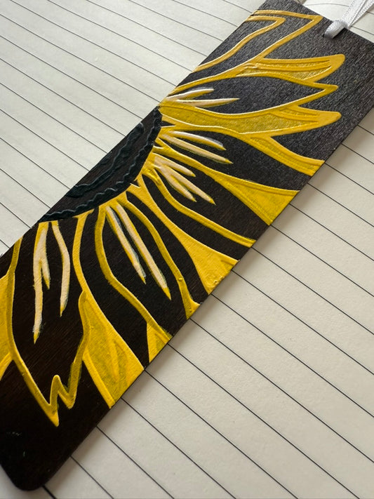 Black and yellow sunflower design on a textured surface