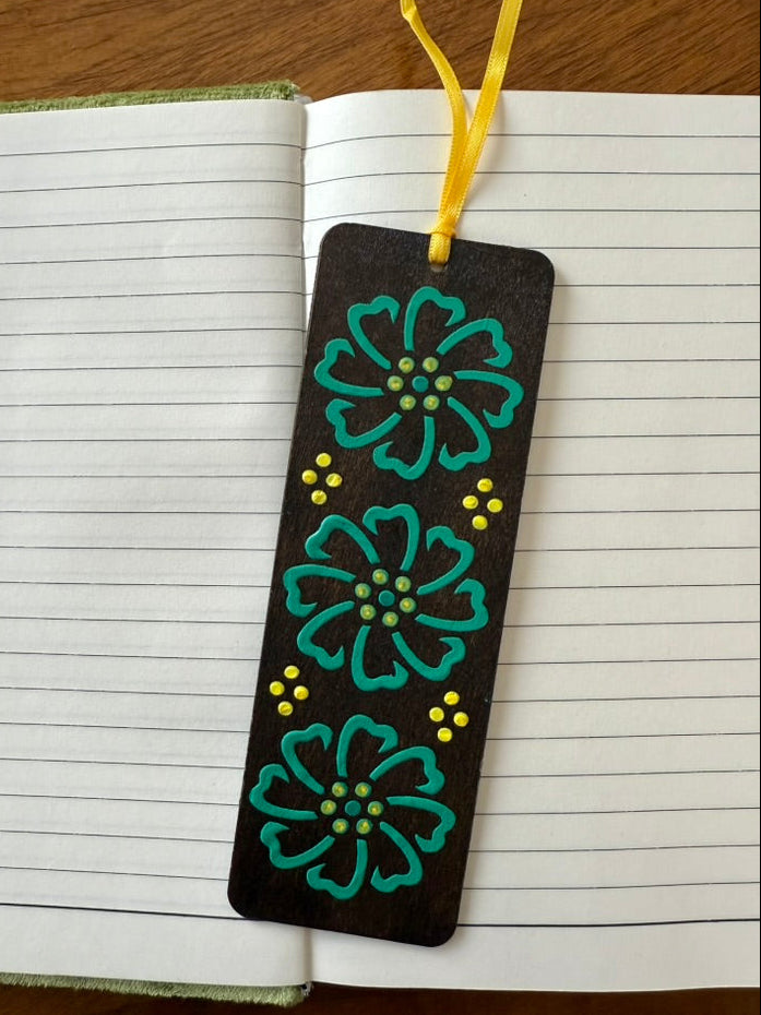 Bookmark with floral design on a notebook page