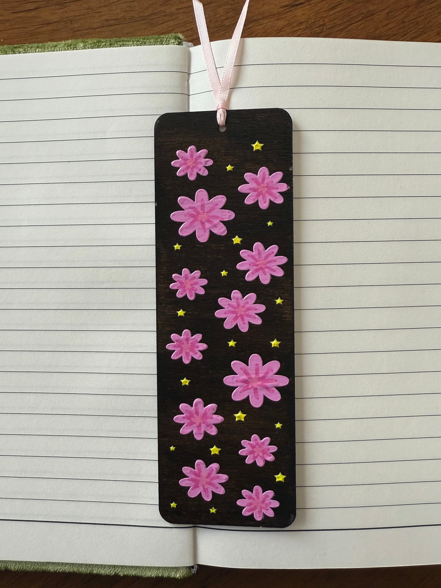 Bookmark with pink floral design on lined paper