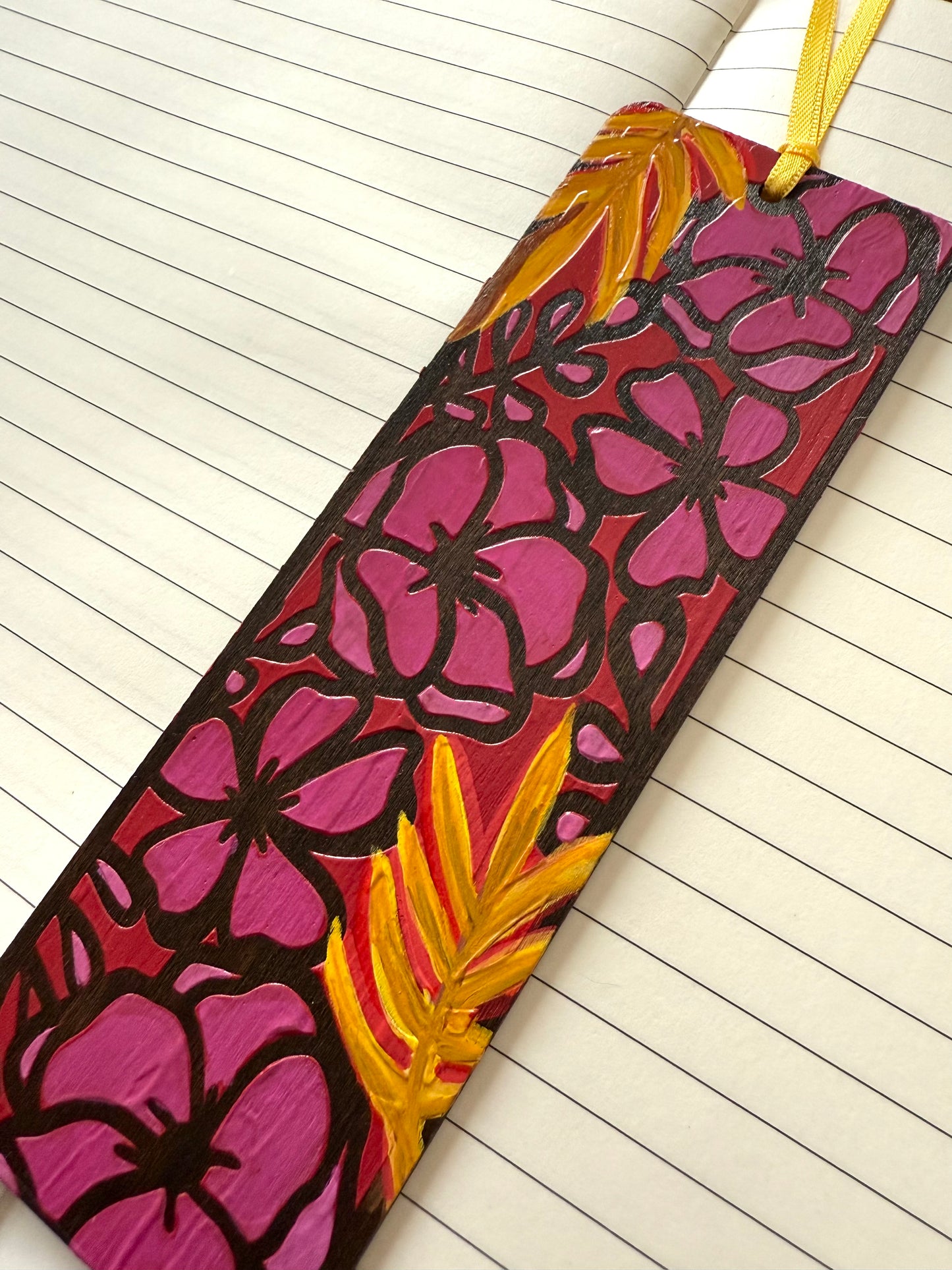 Colorful floral bookmark on a lined notebook page