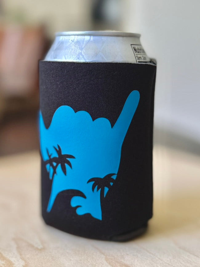 Can with a blue and black design on a wooden surface