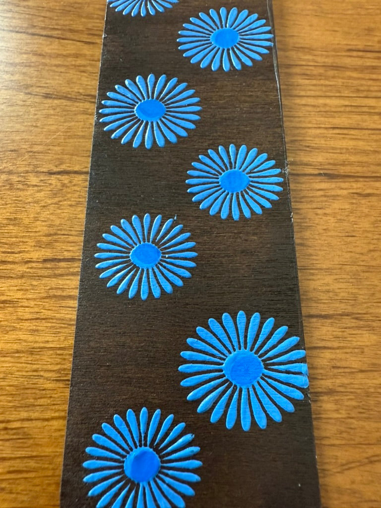 blue floral patterns on a wooden surface