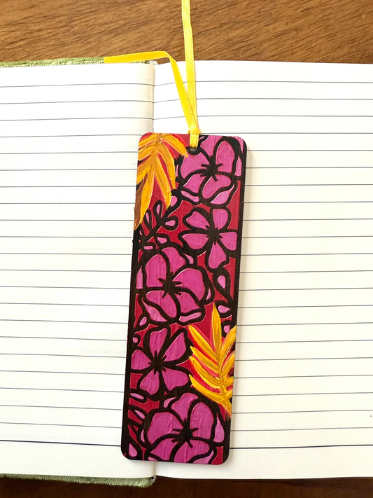 Floral bookmark with pink and yellow design on a notebook page