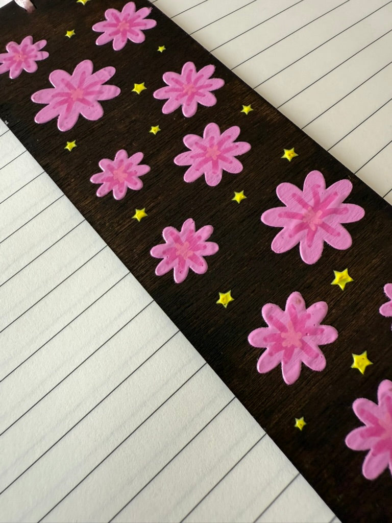 Floral patterned bookmark with pink flowers on a black background