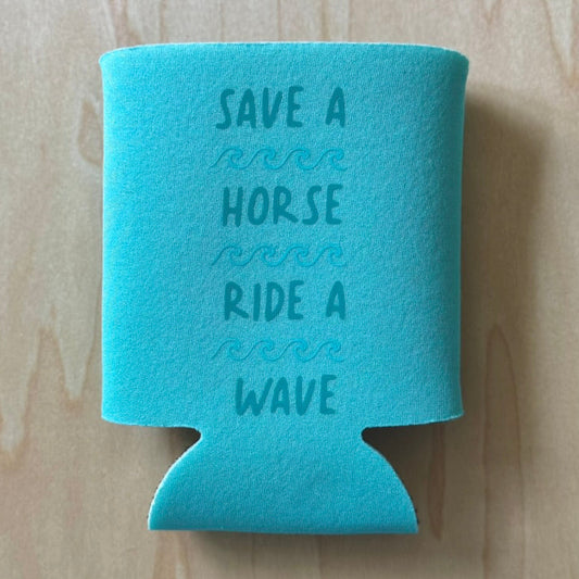 Turquoise can cooler with motivational quote on a wooden surface