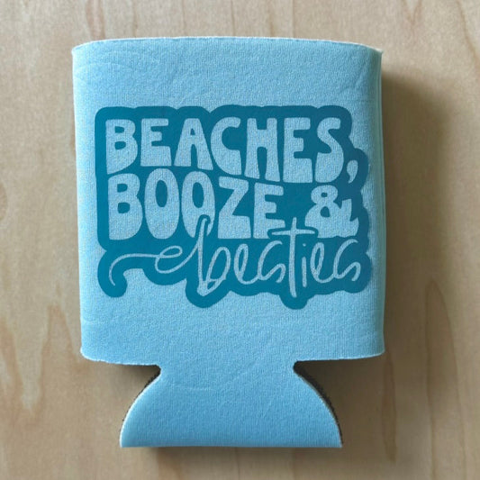 Blue can cooler with 'Beaches, Booze & Bees' text on a wooden surface
