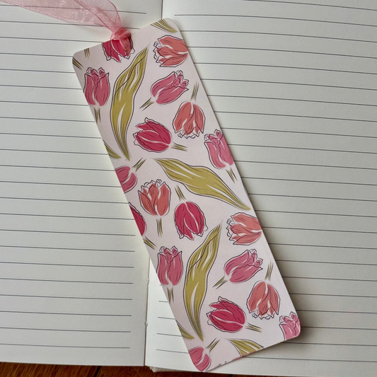Floral patterned bookmark on an open notebook
