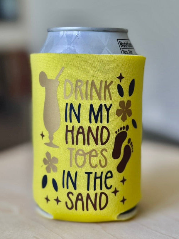 Yellow can cooler with text and graphics on a wooden surface