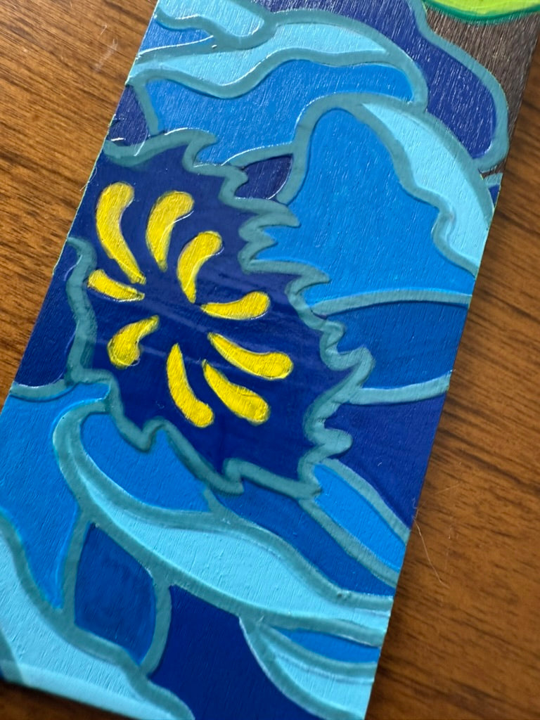 Colorful abstract design on a wooden surface