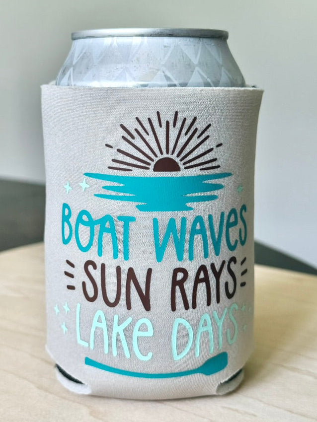 Can cooler with 'Boat Waves, Sun Rays, Lake Days' text on a light surface.