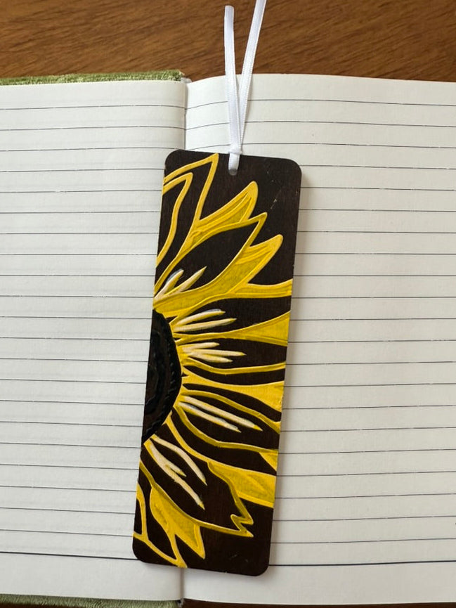 Sunflower design bookmark on a notebook page