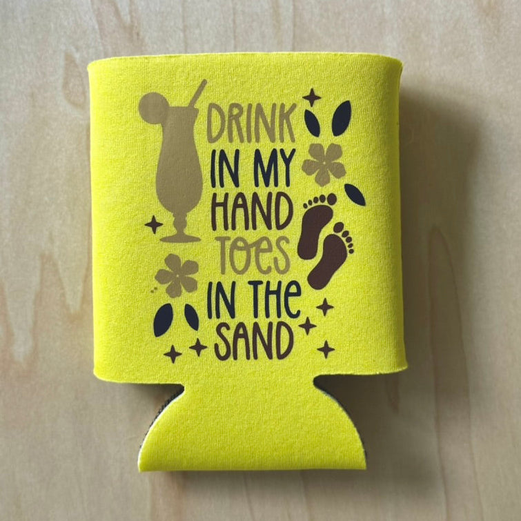 Yellow can cooler with text and graphics on a wooden surface
